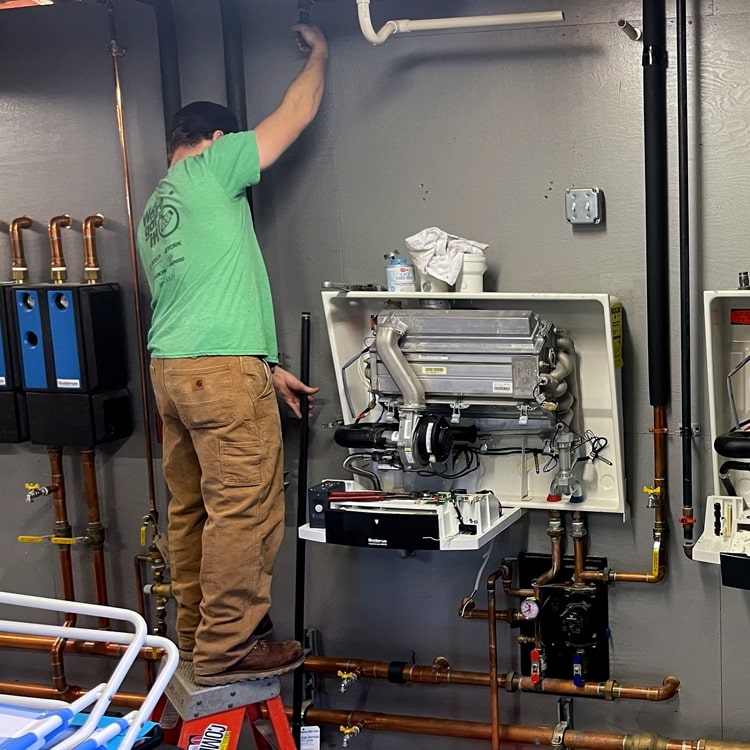 Seaside Gas Technician On A Plumbing Job