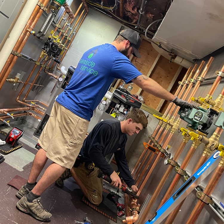 Seaside Gas Technicians Working On A Plumbing Job